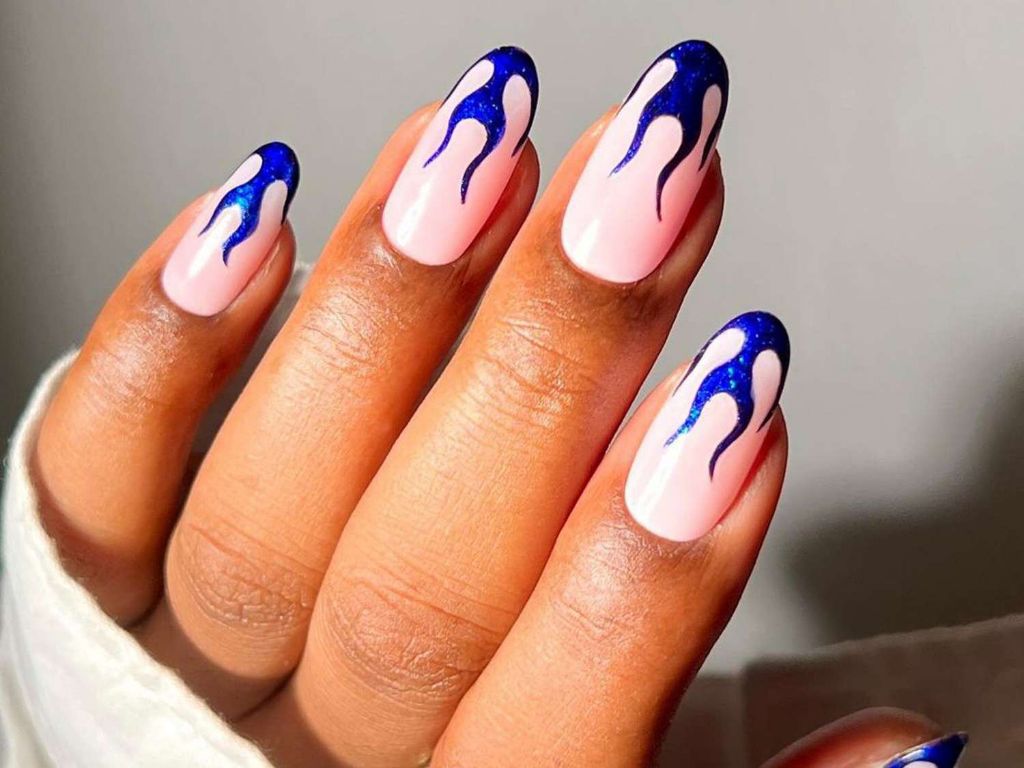 flame nail art is an edgy look that's easy to recreate at home using a detail brush and nail polishes.